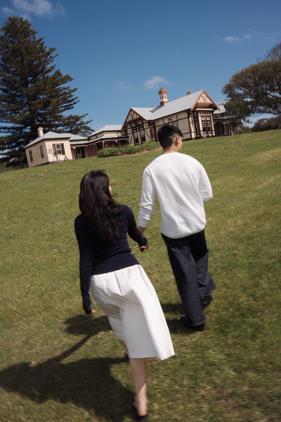 Kobe and Chesqa walking across the lawn